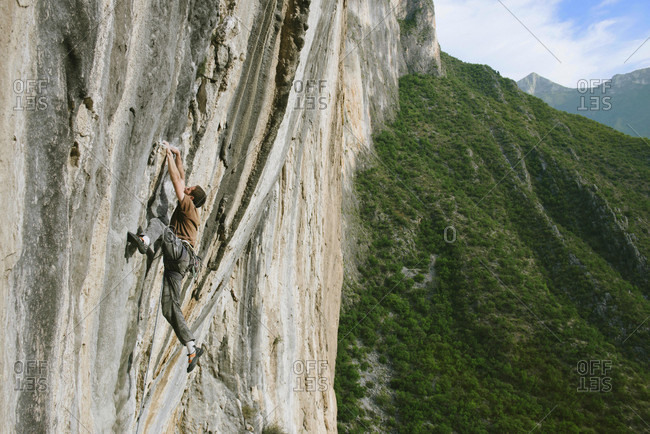 El Potrero Chico, Monterrey, Mexico - December 25, 2014: Rock climber climbing cliff at Celestial Omnibus (512a) climbing route of El Portero Chico, Monterrey, Mexico