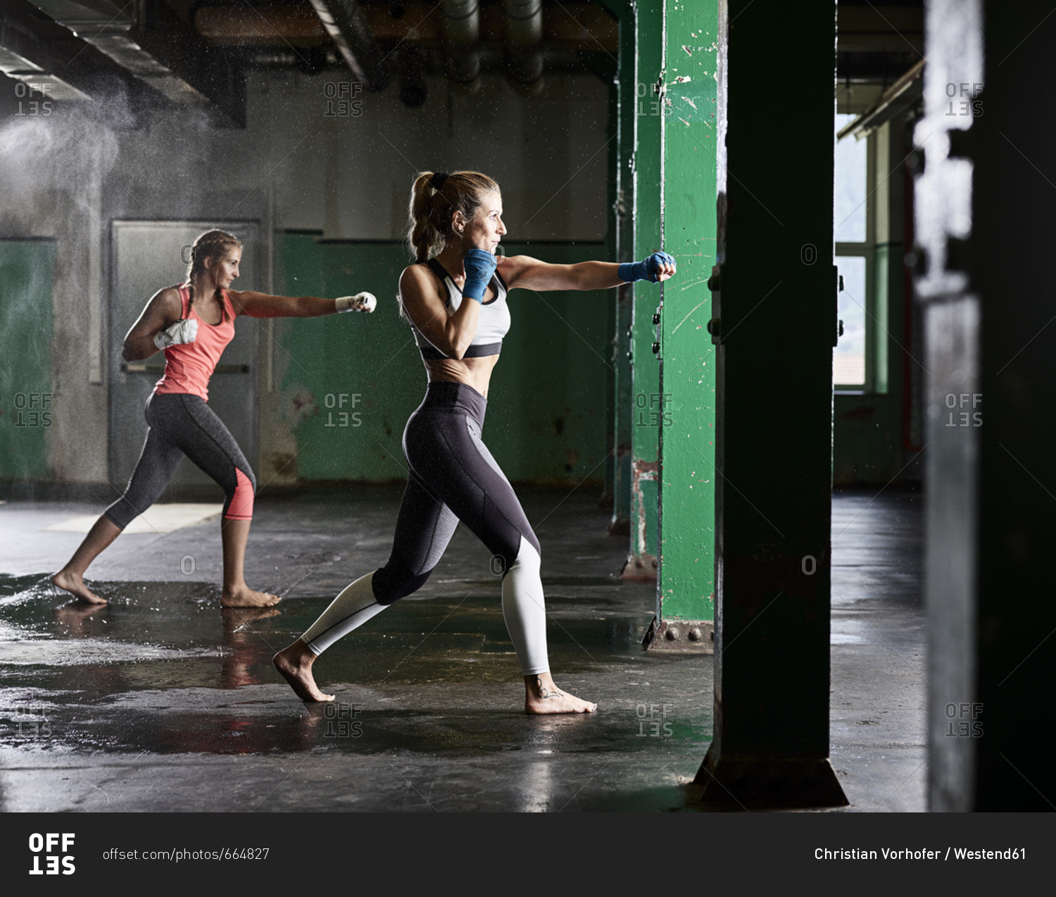Two women having martial arts training