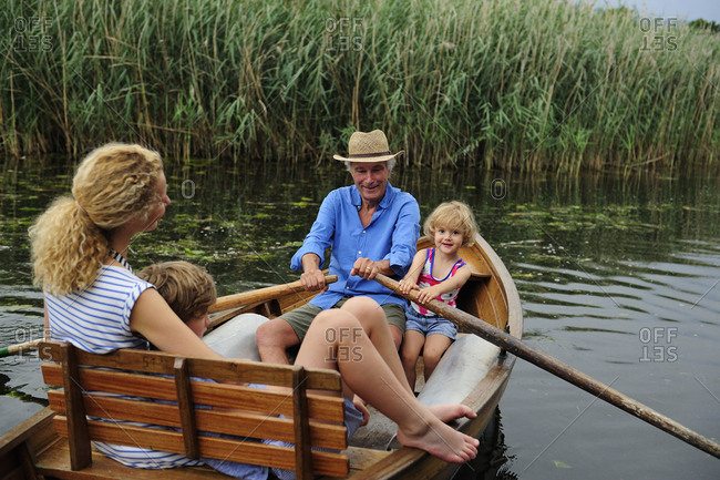 Family in rowing boat on lake