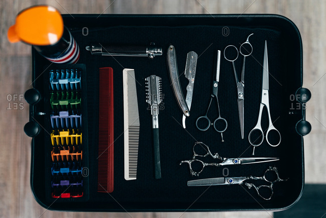 From above set of professional scissors and combs for barber in the shop