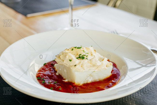 Cod with cream and  tomato sauce