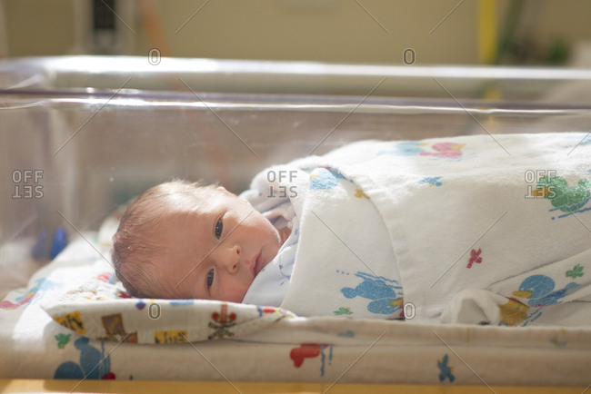 cute newborn baby boy sleeping in hospital