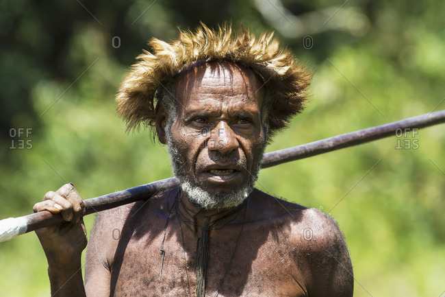 October 4, 2013: Dani Man Wearing An Elaborate Headdress Of Bird Of Paradise Or Cassowary Feathers, Obia Village, Baliem Valley, Central Highlands Of Western New Guinea, Papua, Indonesia