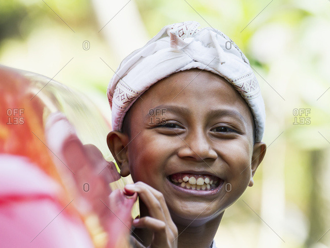 September 18, 2014: Boy At A Ngaben Or Cremation Ceremony, Klungkung, Bali, Indonesia