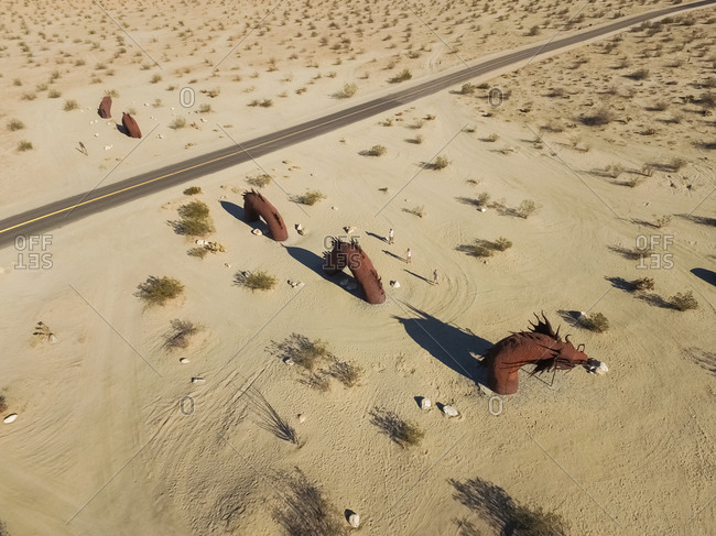 Aerial view of friends at Dragon sculpture in Californian desert in Borrego Springs, USA.