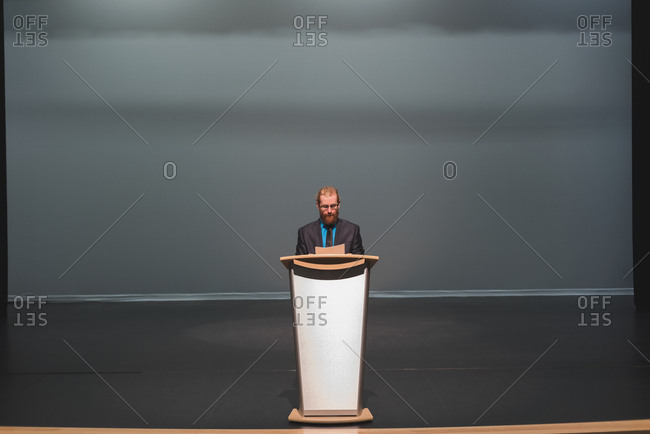 Man practicing his speech on stage at theater