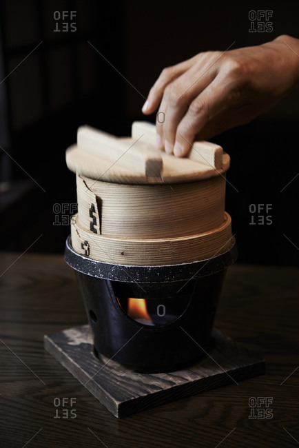 Mushi-mono being prepared by steaming over flames