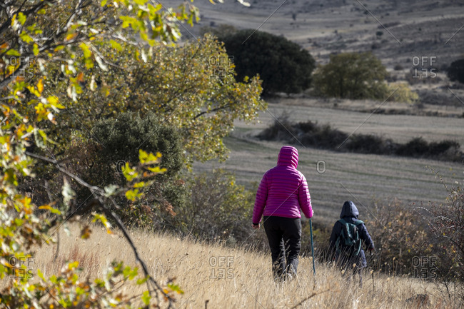 Two hikers in the Tierras Altas region in the province of Soria in Spain