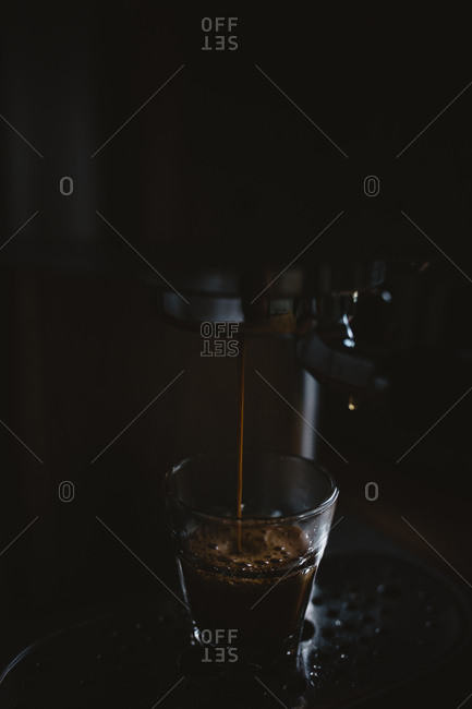 Dark moody photo of espresso being made