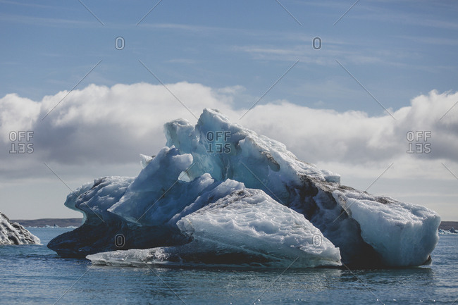 Large dark blue iceberg in Jokulsarlon glacier lagoon of south Iceland