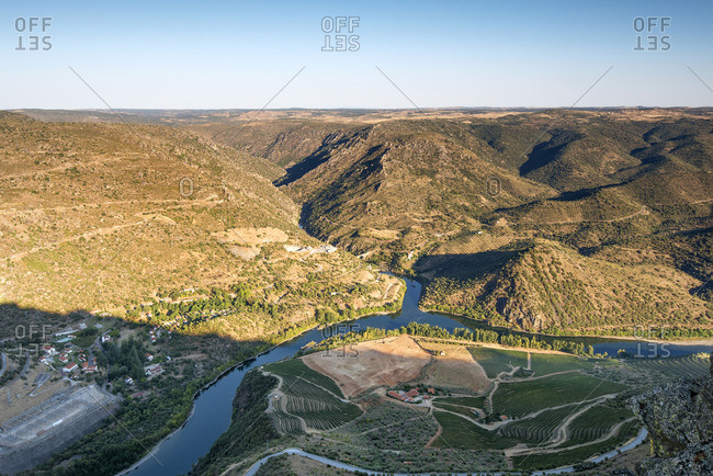 Douro river between Portugal and Spain, in the evening. Portugal on the foreground and Spain on the background. Portugal