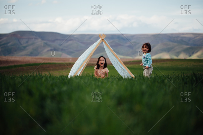 Girls laughing in teepee