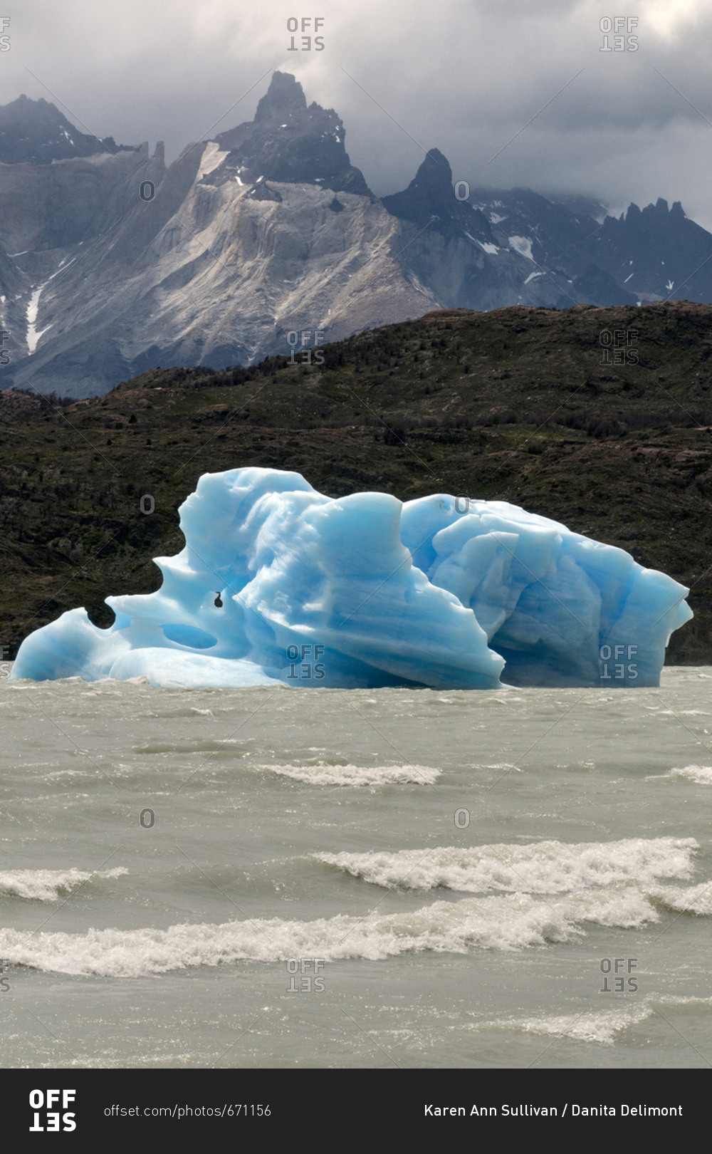 UNESCO World Heritage Site, Perito Moreno Glacier, Los Glaciares National Park, Argentina, South America, A large piece of blue ice in the foreground of mountains
