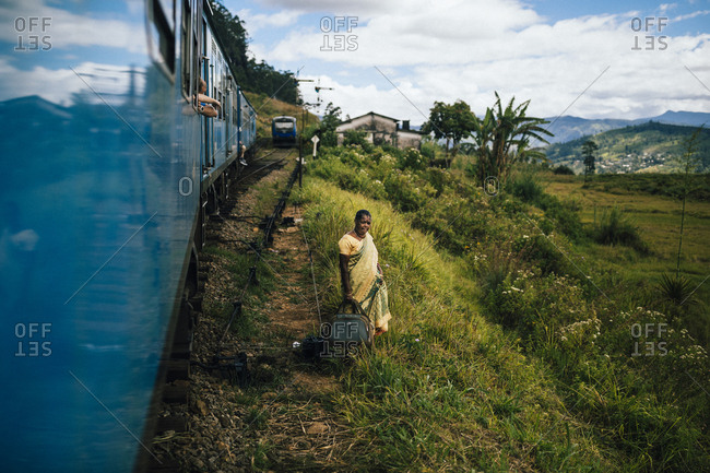 Ella, Sri Lanka - February 1, 2018: A train driving around bend in tea plantation  countryside