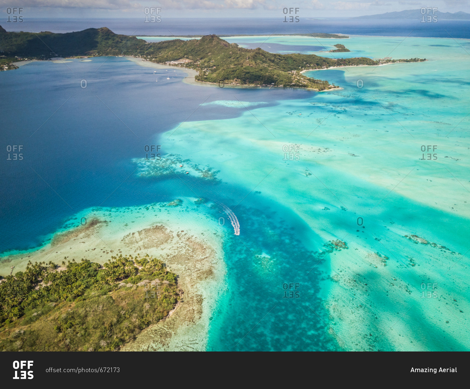 Aerial view of a boat in the reef in BoraBora, French Polynesia. stock