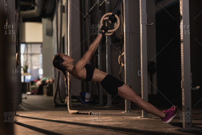 Fit woman exercising with ring