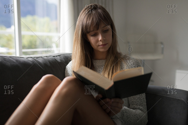 Woman Reading In Luxury Living Room