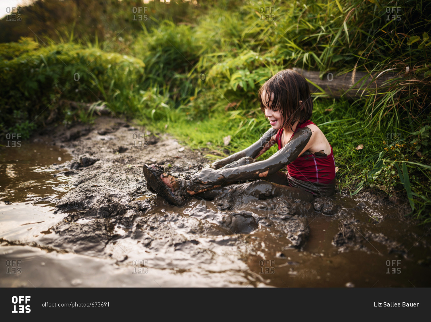 Children playing in mud - Offset stock photo - OFFSET