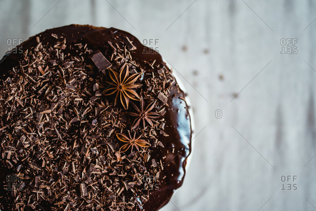 Chocolate cake topped with dark chocolate shavings and star anise