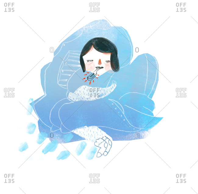 A woman having a cold and nestling up in blankets