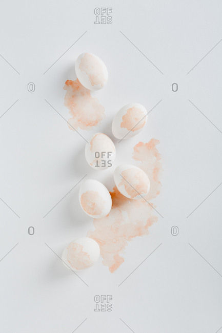 Artistic product shot with stained eggs on pale background