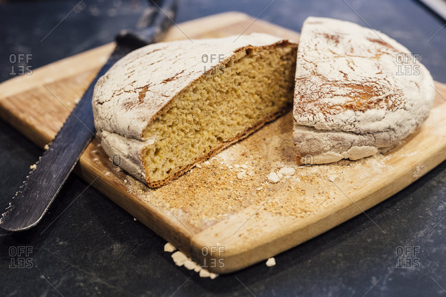 freshly baked bread cut on cutting board