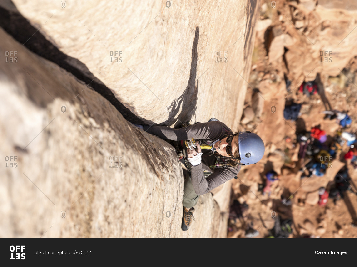 High angle view of male hiker climbing mountain
