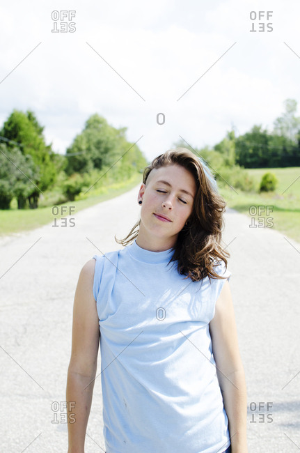 Young woman on country road