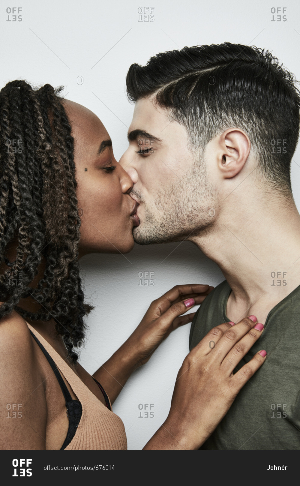 Ebony girl kissing black man