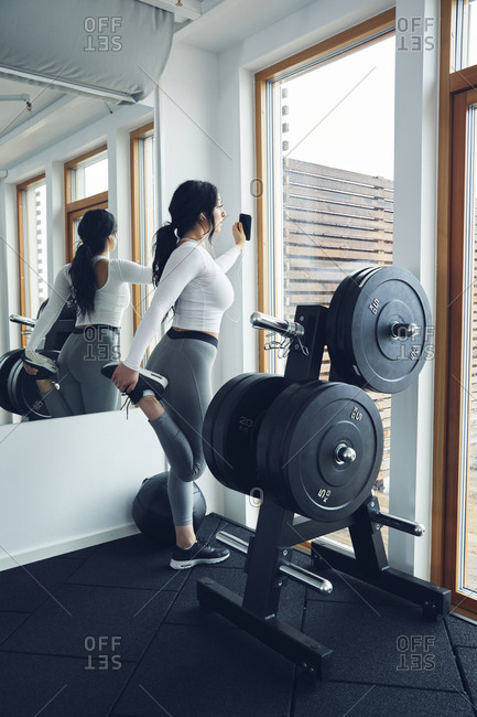 Woman stretching in gym