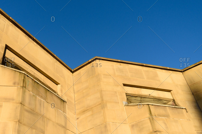 Looking up at sunlit wall in Leeds, United Kingdom
