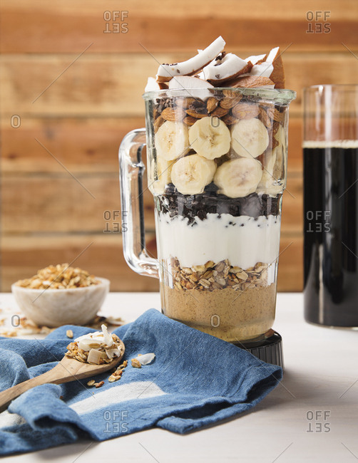 Blender full of healthy ingredients to make a smoothie