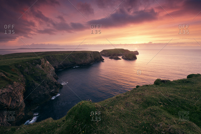 Sunset at the cliffs of Benwee Head, County Mayo, Ireland