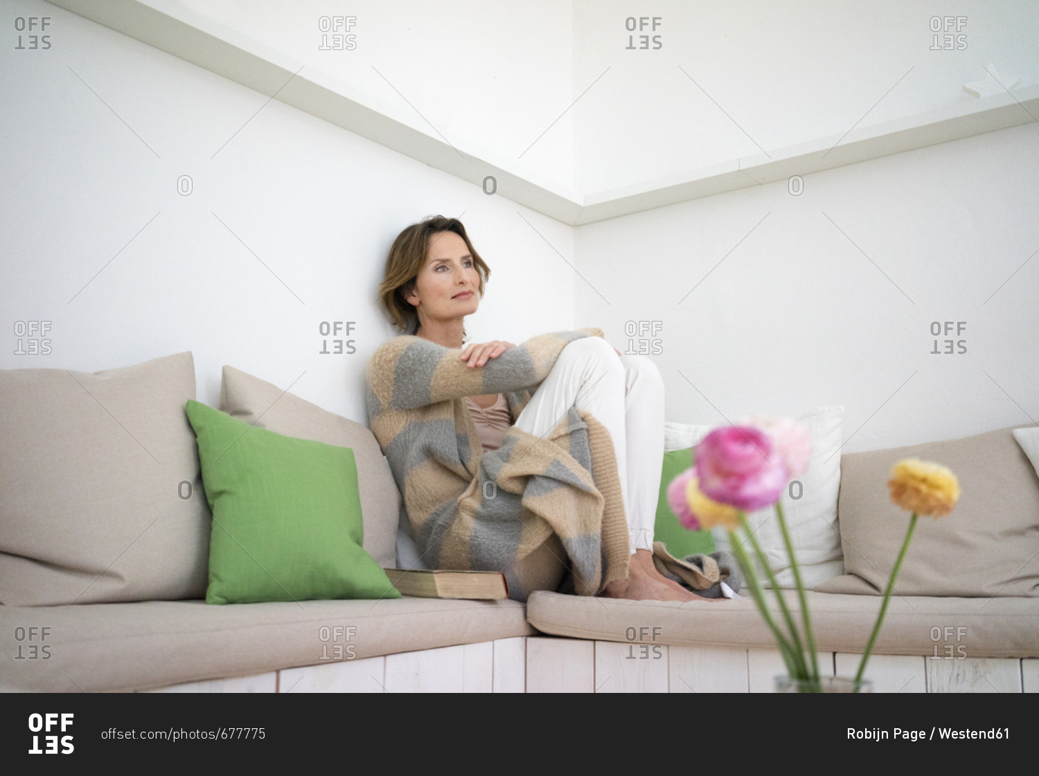 Relaxed mature woman sitting on bench