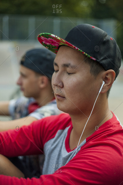 Young men listening to music in BMX park, Budapest, Hungary