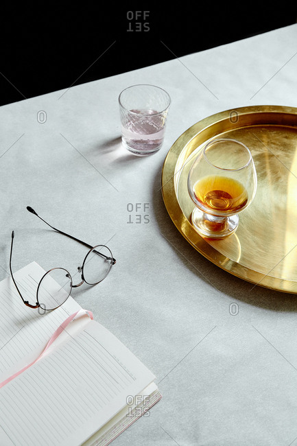 Still life with drinks and golden tray