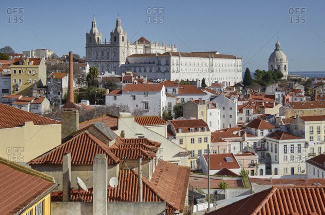 Lisbon, Portugal - 08 January, 2018: Renaissance spires of Church of Sao Vicente of Fora dome of National Pantheon rising over roofs of apartment buildings dome of National Pantheon