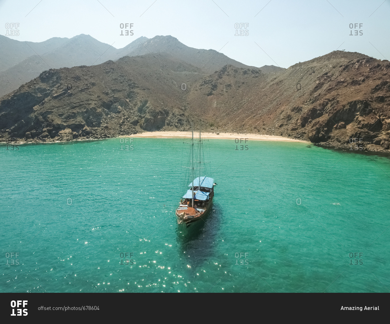 Aerial view of a sailboat in the picturesque bay of Khor Fakkan, United Arab Emirates.