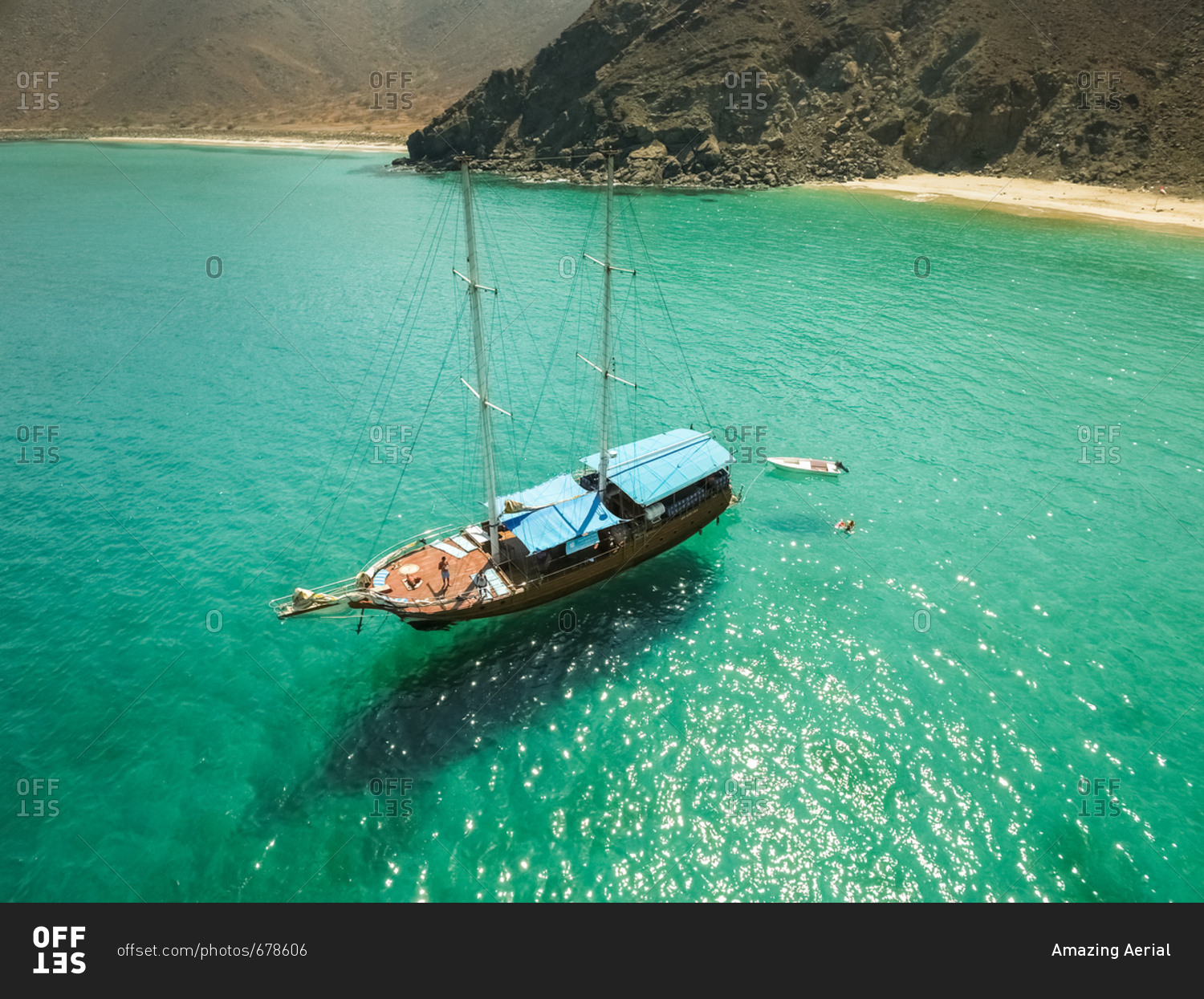 Aerial view of a sailboat in the picturesque bay of Khor Fakkan, United Arab Emirates.