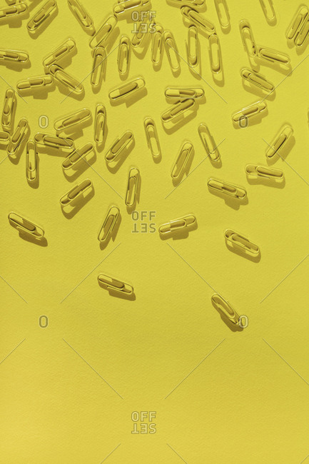 Overhead view of randomly scattered paperclips