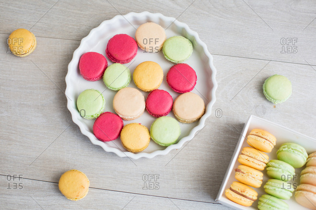 High angle view of colorful macaroons laid out in a pie dish