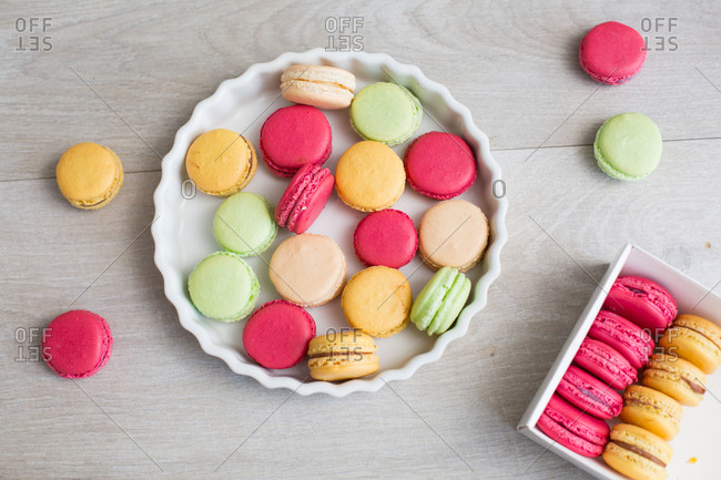 Top down view of random assortment of macaroons in pie dish