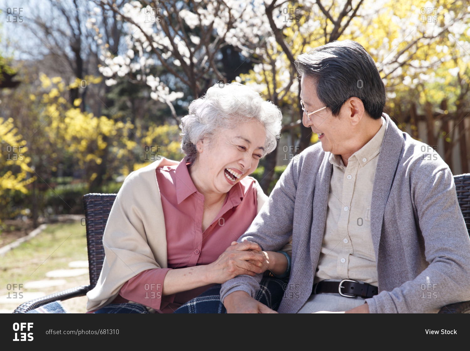 The happy old couple basked in the sun stock photo - OFFSET