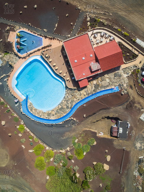 FUERTEVENTURA, CANARY ISLANDS - 1 March 2018 : Aerial view of a restaurant with swimming pool on the coast of Fuerteventura, Canary Islands.