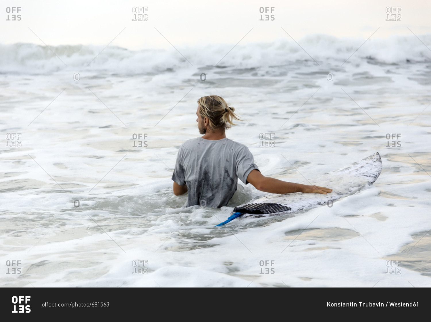 Indonesia- Bali- surfer and surfboard in the water