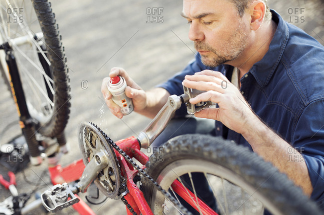 Man repairing bicycle