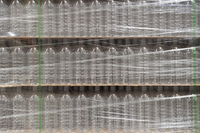 Close-up of pallets of bottled water in a bottling plant.