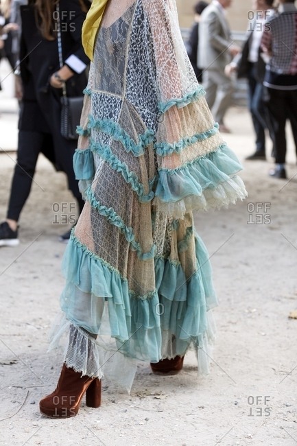 Woman wearing lace Kaftan with frills and velvet platform boots