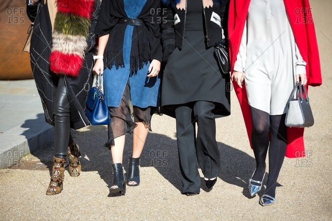 Group of eclectically dressed women striding down the street