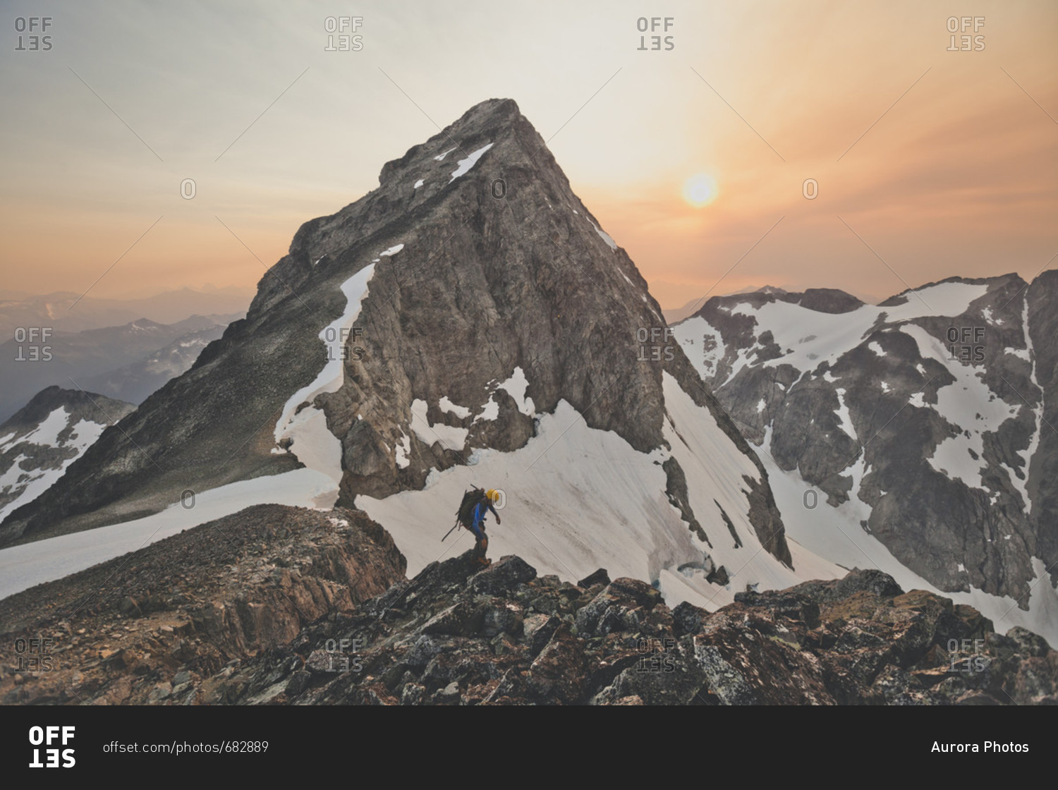 Mountain climber near peak of Ashlu Mountain, Coast Mountain Range, Squamish, British Columbia, Canada